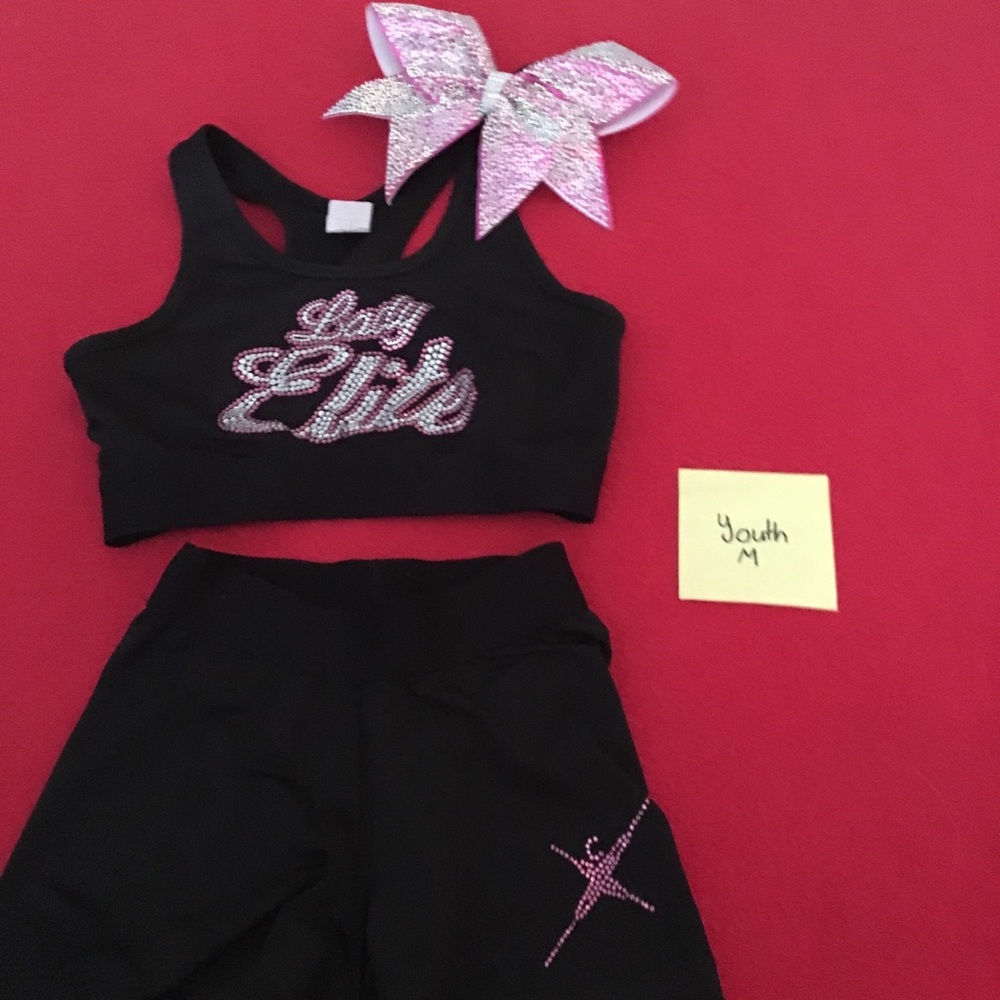 A Cheer Extreme Lady Elite practice wear w/ a bow